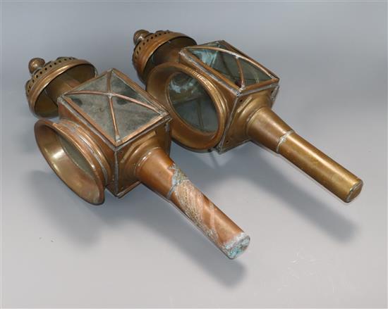 A pair of copper coach lamps